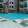 swimming pool with lounge chairs